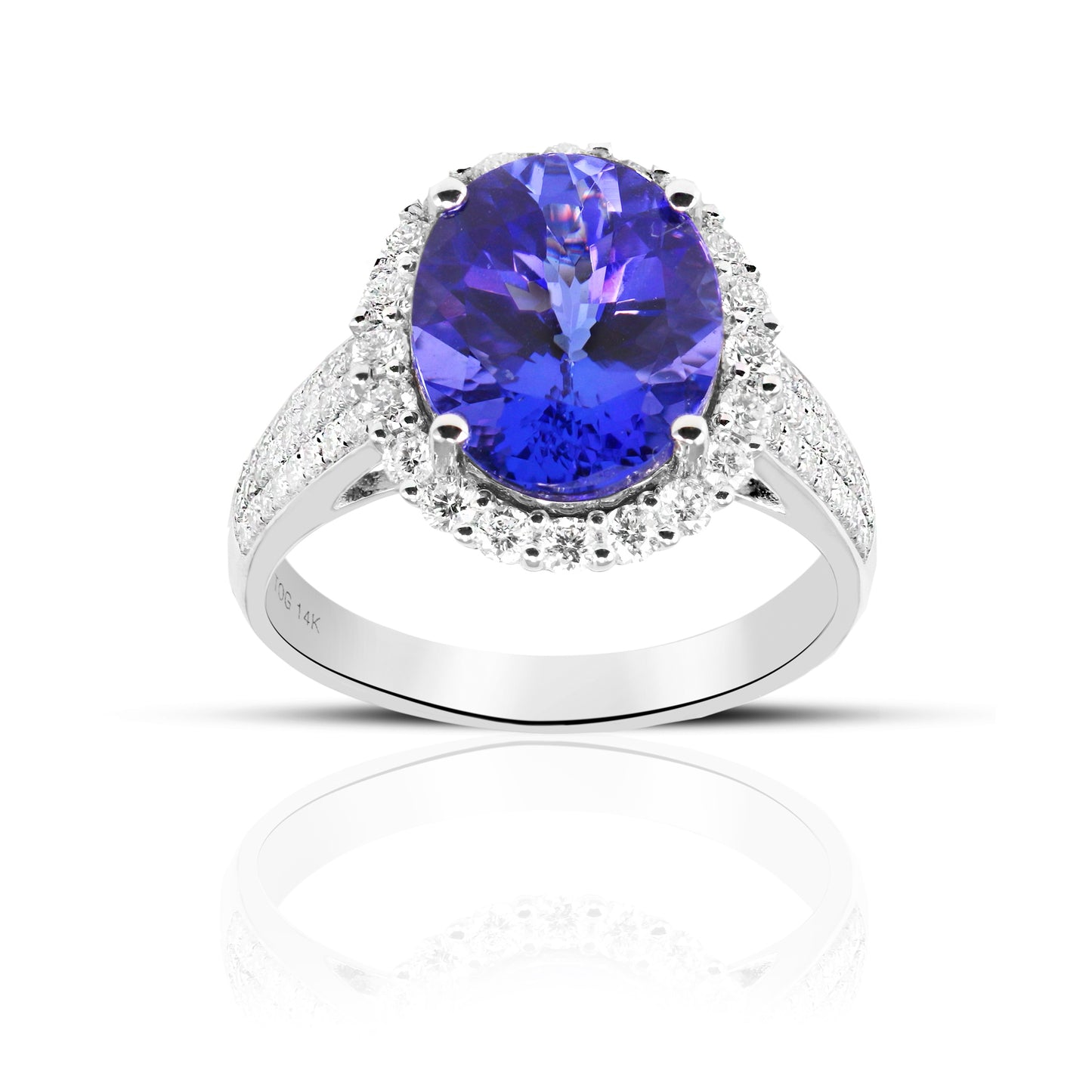 Cocktail style Oval Tanzanite Diamond halo ring with Pave' Diamond accents 14 Karat White Gold