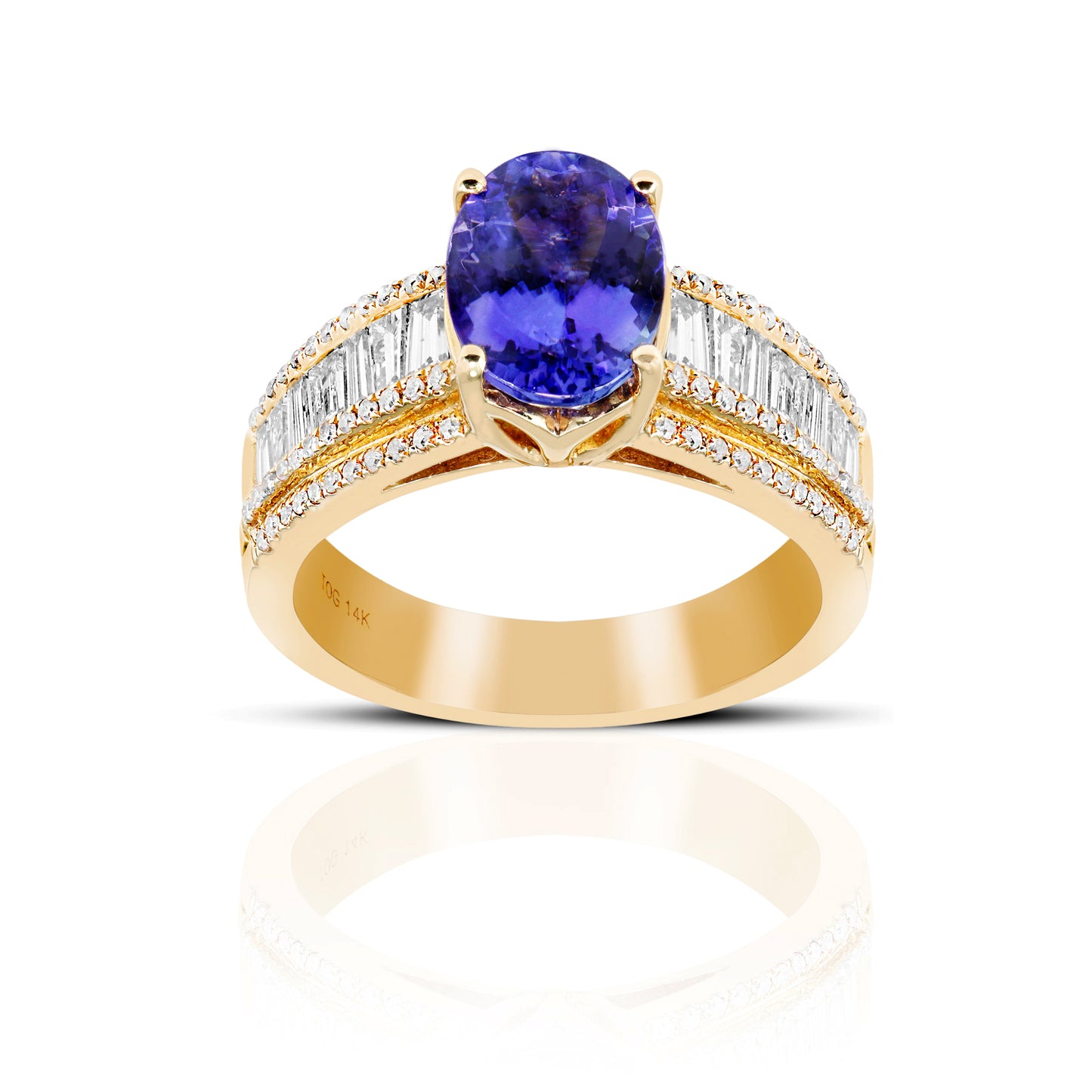 Oval Solitaire Tanzanite Cocktail ring with Baguette Diamond accents 14 Karat Yellow Gold